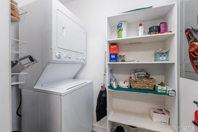 laundry room featuring stacked washer and dryer