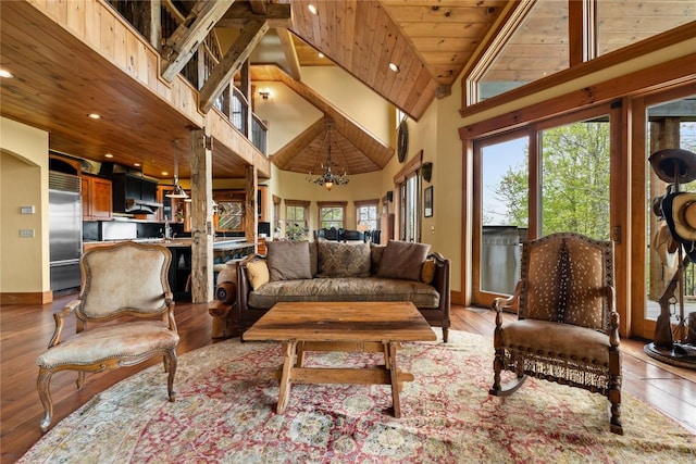 living room featuring high vaulted ceiling, a chandelier, recessed lighting, wooden ceiling, and wood finished floors