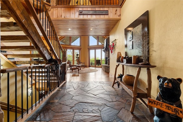 hall with a textured wall and stairs