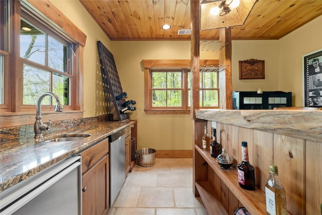 kitchen with a sink, stainless steel dishwasher, wooden ceiling, stone counters, and recessed lighting