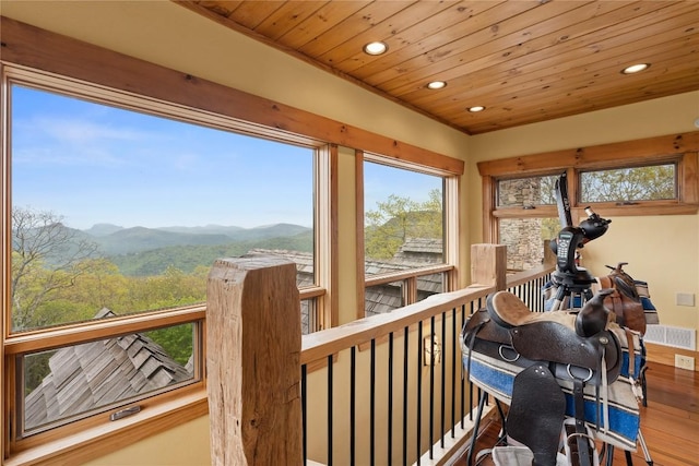 sunroom / solarium featuring a mountain view