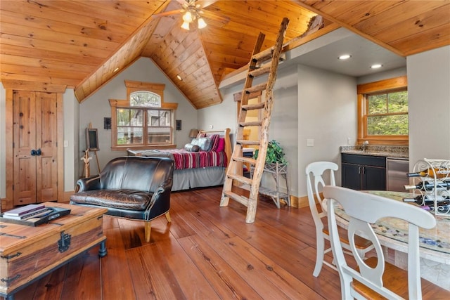bedroom featuring wooden ceiling, hardwood / wood-style floors, bar with sink, and lofted ceiling