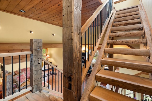 staircase with wooden ceiling