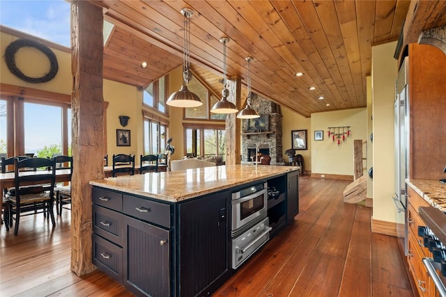 kitchen featuring open floor plan, a warming drawer, dark wood-style flooring, wooden ceiling, and lofted ceiling