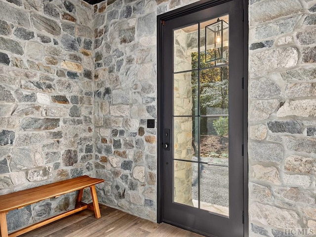 doorway to outside with hardwood / wood-style floors