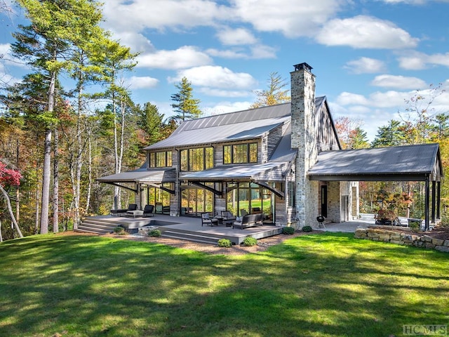 back of house featuring a yard and a patio