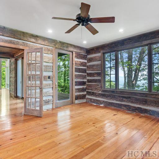 spare room with a wealth of natural light and light wood-type flooring