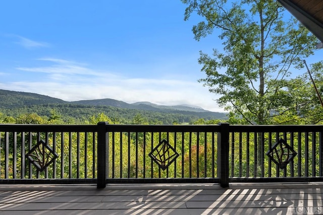 wooden terrace featuring a mountain view