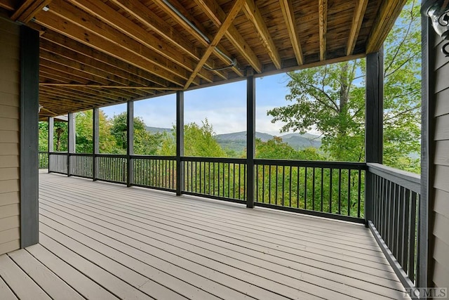 wooden terrace featuring a mountain view