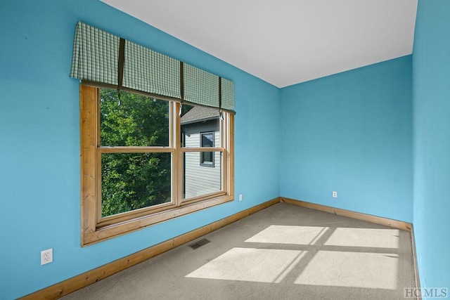 unfurnished room featuring carpet