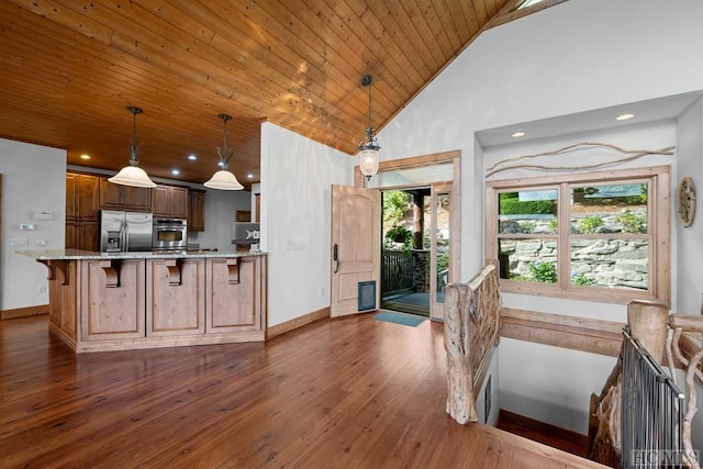 kitchen featuring stainless steel appliances, wooden ceiling, high vaulted ceiling, and decorative light fixtures