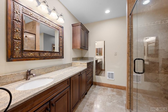 bathroom with vanity and an enclosed shower