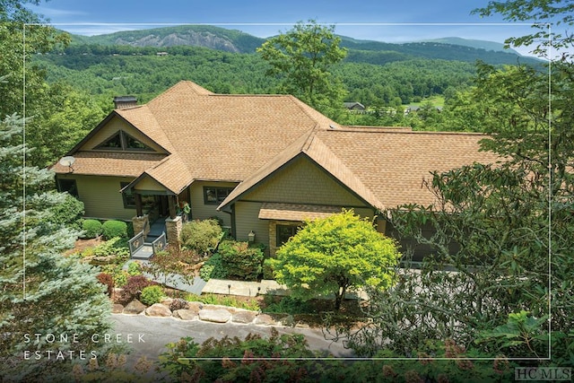 view of front of house featuring a mountain view and a porch