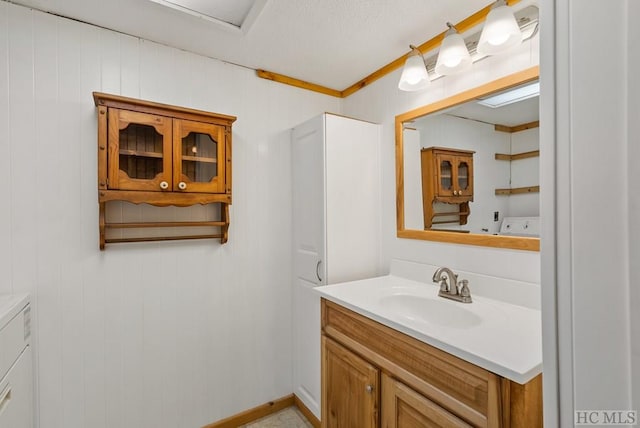 bathroom featuring washer and dryer and vanity