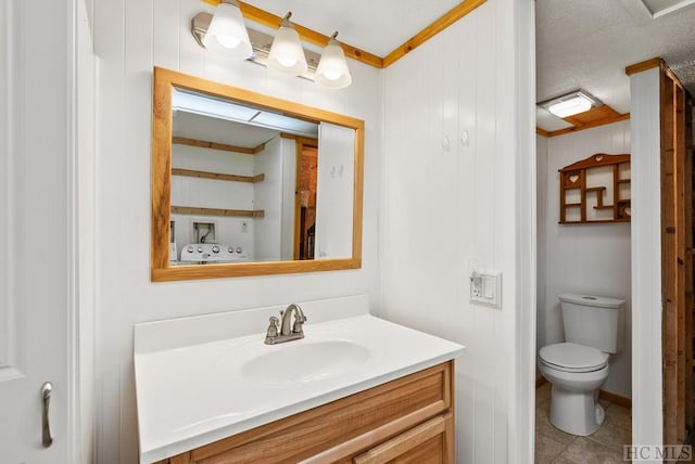 bathroom featuring tile patterned floors, vanity, and toilet