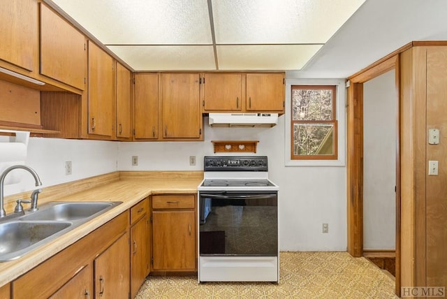 kitchen featuring sink and electric range