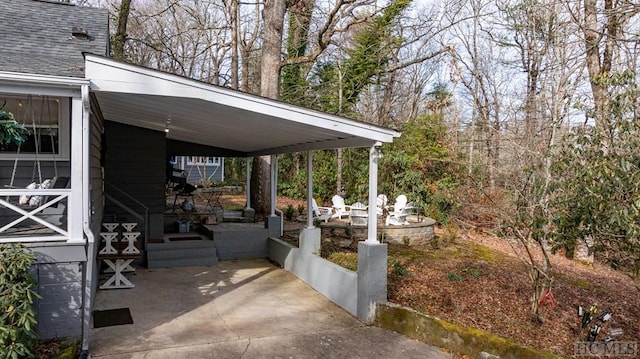 view of patio / terrace featuring a carport