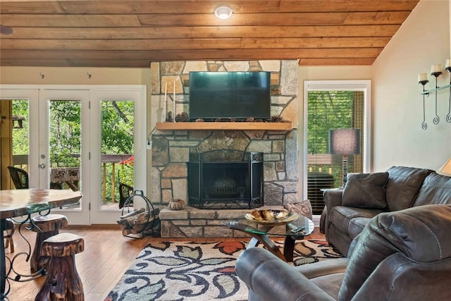 369 Meadow Way Unit 1713, Sapphire, NC 28774 - living room featuring wooden ceiling, hardwood / wood-style flooring, vaulted ceiling, and a stone fireplace