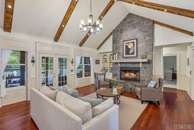 living room with french doors, beam ceiling, high vaulted ceiling, dark hardwood / wood-style floors, and a fireplace