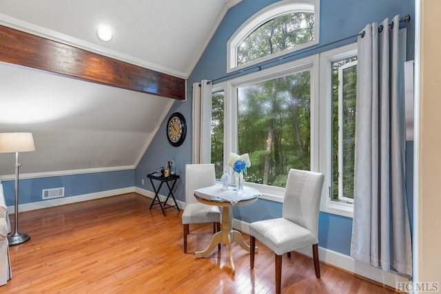 sitting room featuring lofted ceiling and hardwood / wood-style flooring