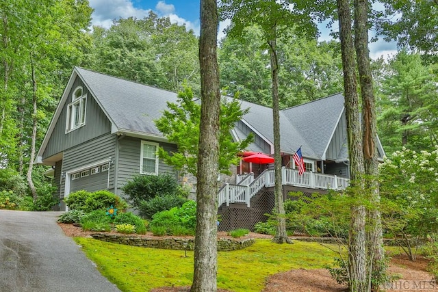 view of front of house with a garage and a porch