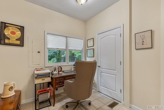 office area featuring light tile patterned floors and electric panel