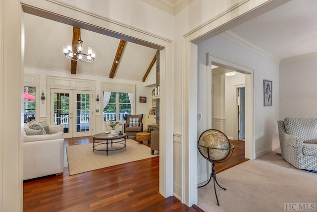 living room with an inviting chandelier, vaulted ceiling with beams, wood-type flooring, and french doors