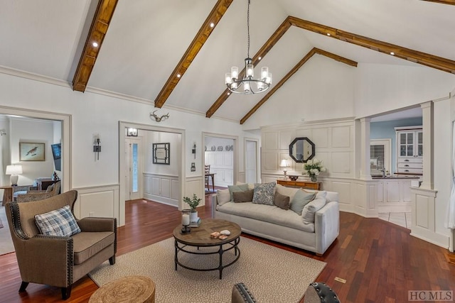 living room featuring dark hardwood / wood-style flooring, beam ceiling, high vaulted ceiling, and a chandelier