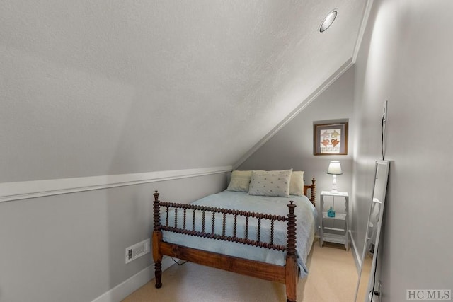 carpeted bedroom featuring lofted ceiling