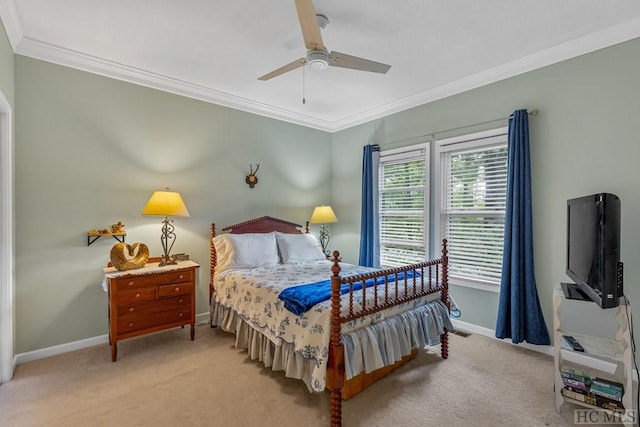 carpeted bedroom featuring ornamental molding and ceiling fan