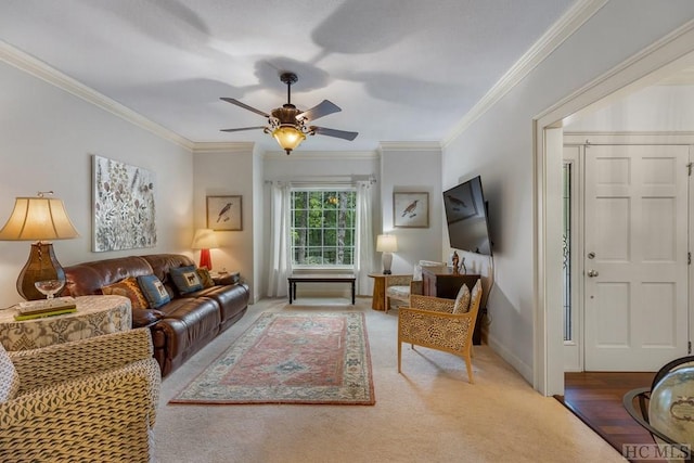 living room with crown molding and ceiling fan