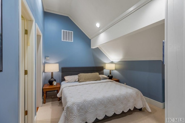 carpeted bedroom featuring ornamental molding and vaulted ceiling