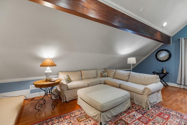 living room featuring vaulted ceiling with beams and hardwood / wood-style floors