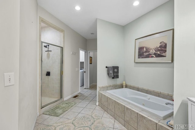 bathroom featuring independent shower and bath and tile patterned floors