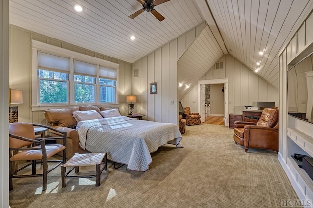 bedroom with lofted ceiling, ceiling fan, wooden walls, wooden ceiling, and light colored carpet