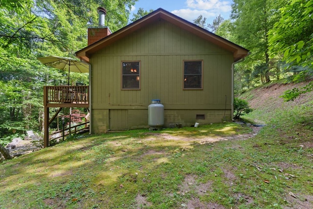 293 Gem Creek Rd, Cullowhee, NC 28723 - view of side of property featuring a chimney, a wooden deck, crawl space, and a lawn