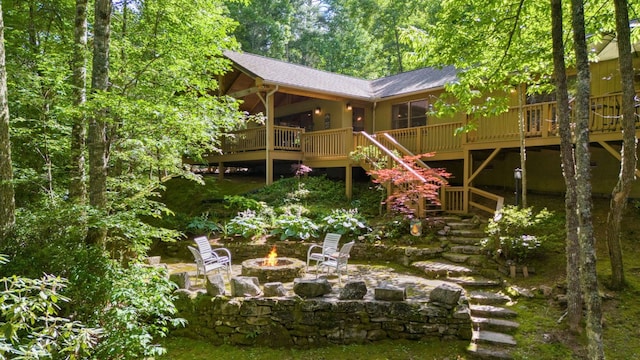 293 Gem Creek Rd, Cullowhee, NC 28723 - rear view of house with a fire pit, stairway, a shingled roof, and a deck