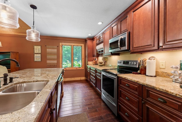 293 Gem Creek Rd, Cullowhee, NC 28723 - kitchen featuring appliances with stainless steel finishes, pendant lighting, dark wood-style floors, light stone countertops, and recessed lighting