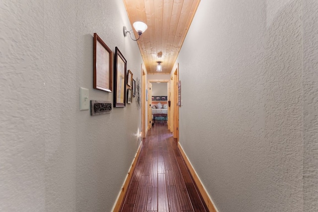 293 Gem Creek Rd, Cullowhee, NC 28723 - corridor with a textured wall, dark wood finished floors, and wood ceiling