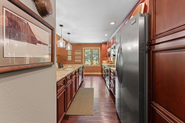 293 Gem Creek Rd, Cullowhee, NC 28723 - kitchen with stainless steel appliances, dark wood-style flooring, light stone countertops, recessed lighting, and hanging light fixtures