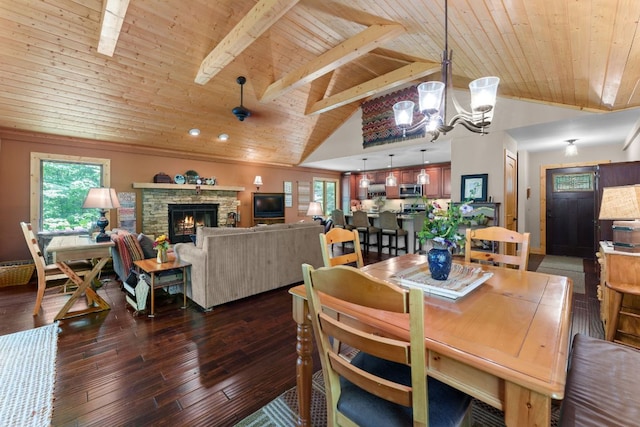293 Gem Creek Rd, Cullowhee, NC 28723 - dining room with wooden ceiling, a chandelier, hardwood / wood-style flooring, and a stone fireplace