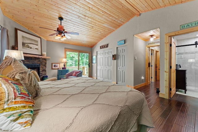 293 Gem Creek Rd, Cullowhee, NC 28723 - bedroom with lofted ceiling, wood finished floors, a fireplace, wooden ceiling, and multiple closets