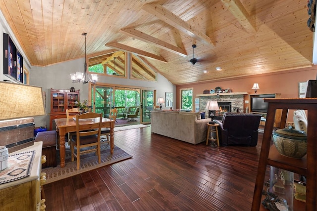 293 Gem Creek Rd, Cullowhee, NC 28723 - living room with a wood ceiling with exposed beams, a chandelier, a stone fireplace, wood finished floors, and high vaulted ceiling