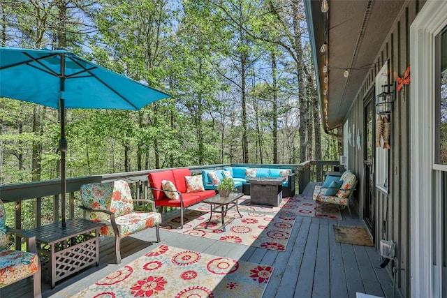 wooden terrace featuring an outdoor living space