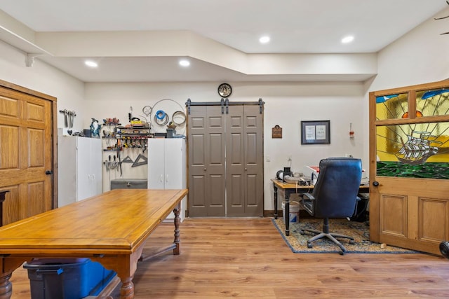 office space with recessed lighting and light wood-style floors