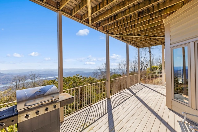 deck featuring a grill