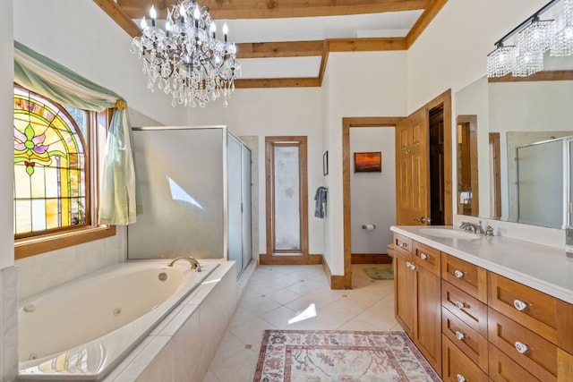 bathroom with a stall shower, vanity, a notable chandelier, and tile patterned floors