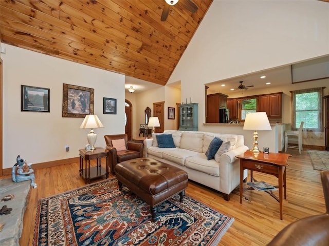 219 Hiwassee Rd, Lake Toxaway, NC 28747 - living area with a ceiling fan, arched walkways, light wood finished floors, and high vaulted ceiling