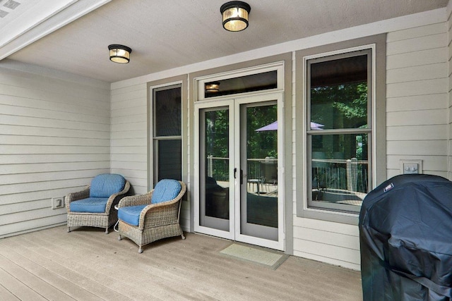 219 Hiwassee Rd, Lake Toxaway, NC 28747 - kitchen with black appliances, tasteful backsplash, light wood finished floors, and light stone countertops