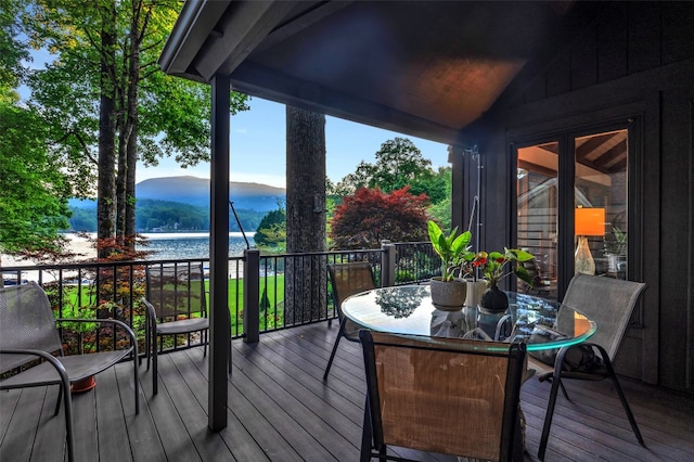 35 Toxaway Landing Dr, Lake Toxaway, NC 28747 - wooden terrace with a water and mountain view and outdoor dining area